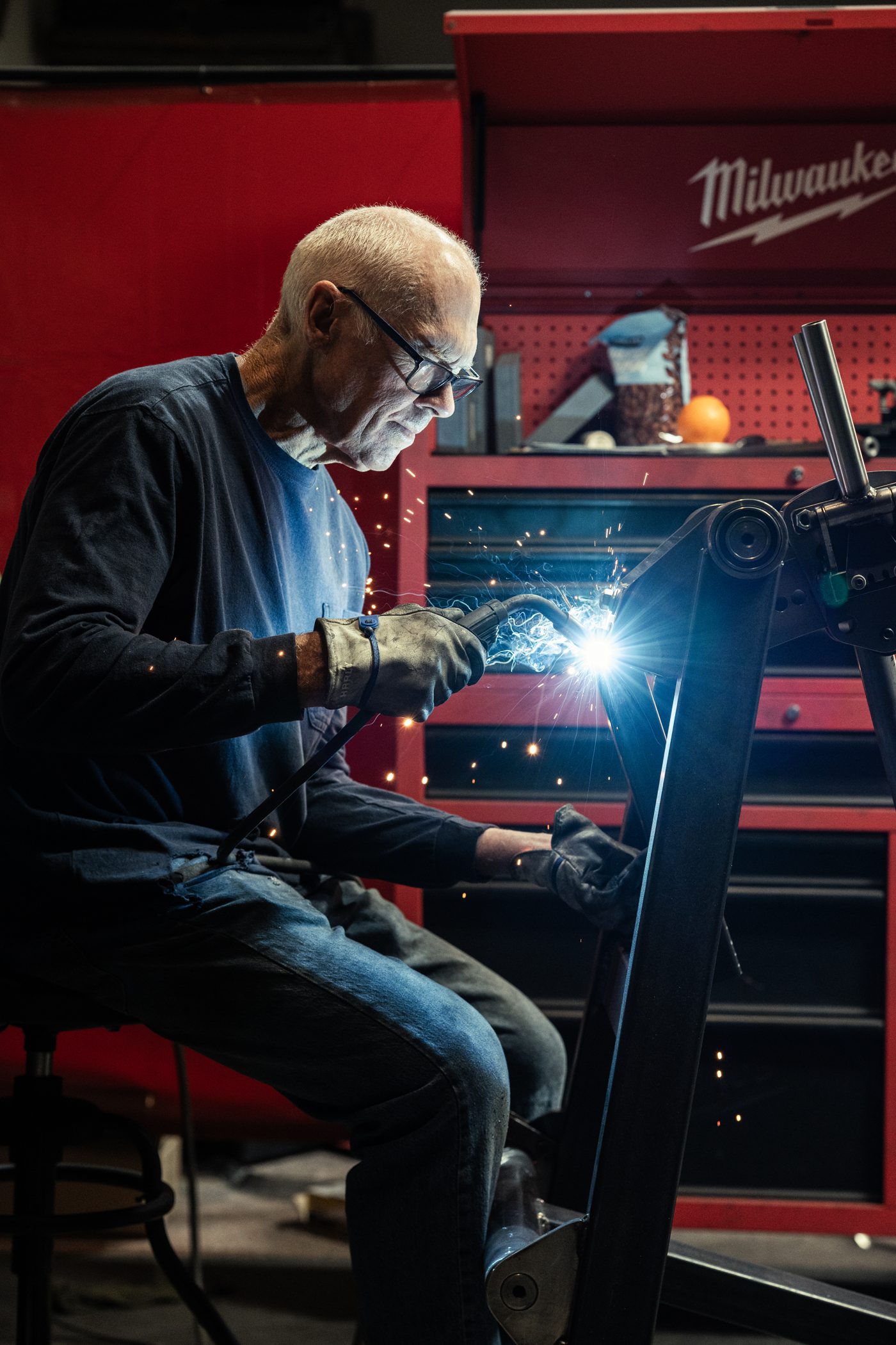 Roy Simonson welding a strength equipment frame in the Skelcore workshop